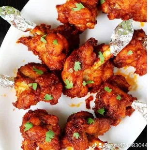 a plate of chicken wings