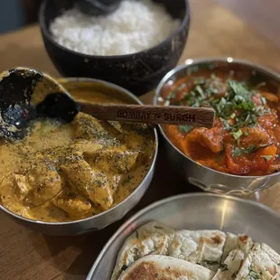 Left: butter chicken Right: vindaloo with chicken Bottom: garlic naan