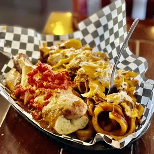 Devil Dog, hot Cheetos on top, When Pigs Fry curly fries, bbq pulled pork and slaw, so good!