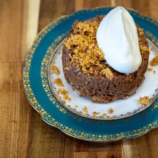 a chocolate cake with whipped cream on top