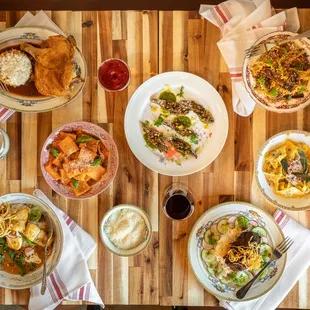 a variety of food on a wooden table