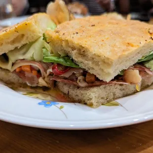 Muffuletta. $20. Serrano ham, duck salami, mortadella, comte, giardiniera, lettuce, focaccia.