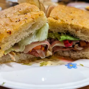 Muffuletta. $20. Serrano ham, duck salami, mortadella, comte, giardiniera, lettuce, focaccia.