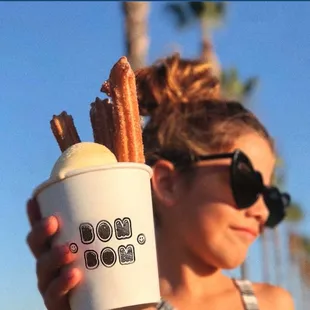  woman holding a cup of ice cream