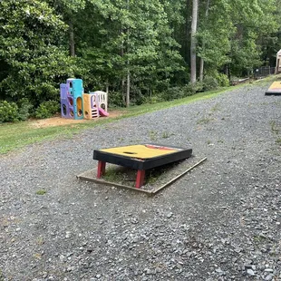 Corn hole and small play place