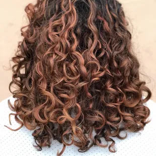 Deva cut and pintura highlights with a rose gold toner