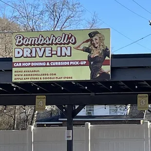 a billboard for bombshells drive - in