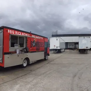 a man standing in front of a food truck