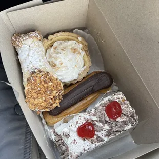 I chose a cassata cake slice, cannoli, eclair, and coconut cream pie