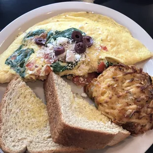 Mediterranean omelette - spinach, tomato, feta cheese, sliced Kalamata olives.
