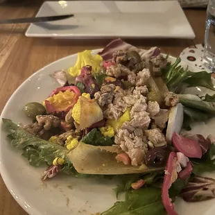 a salad on a white plate