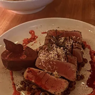 a plate of food with meat and sauce