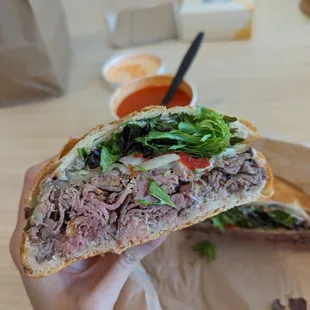 London Broil Sandwich and Tomato Soup in the back