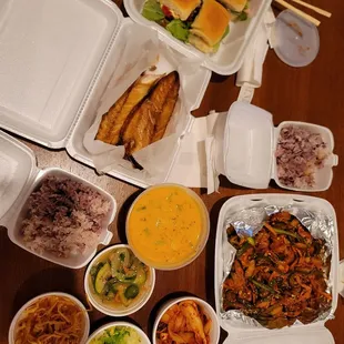 a variety of food in containers on a table