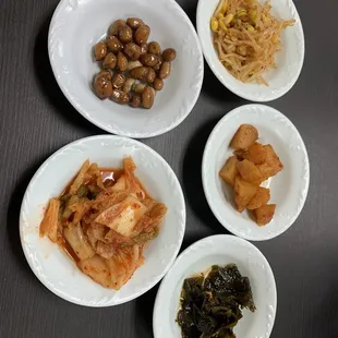 a variety of dishes of food on a table