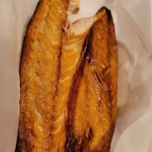 two pieces of fish in a paper bag
