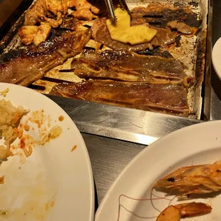 a person preparing food on a grill
