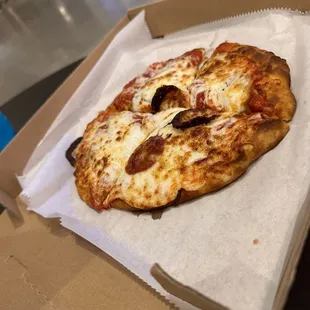 a slice of pizza in a box