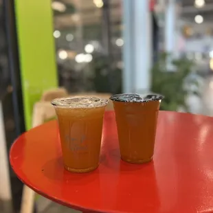 two drinks on a red table