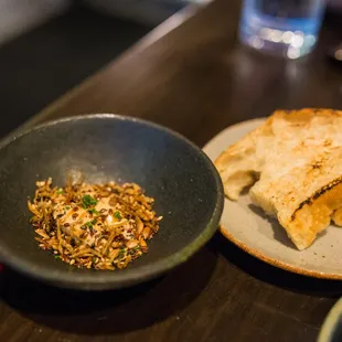 sourdough focaccia - multi-seed candied anchovy, carmelized onion brown butter, aged sherry gastrique (tasting menu)