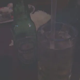 a glass of beer and a bottle of beer