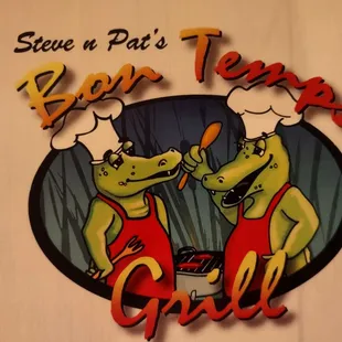 two crocodiles cooking on a grill