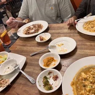Top right, clockwise - Shrimp &amp; Tasso Pasta, Crawfish Etouffee, Praline Chicken and Waffle Sandwich, and Red Bean &amp; Rice.
