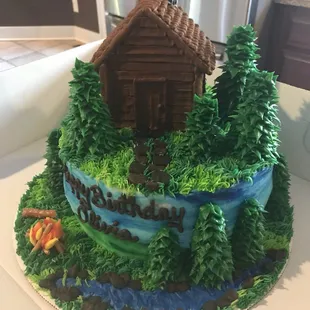 a cake with a cabin on top