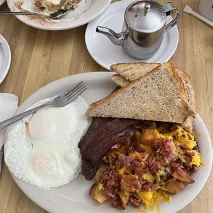 2 eggs over medium  Bacon Rye toast  Hash browns with bacon and cheese