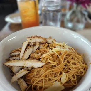 a bowl of noodles and chicken