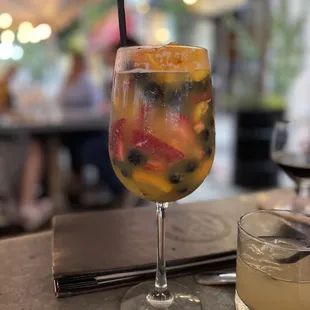 a glass of fruity cocktail