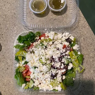 a salad in a plastic container