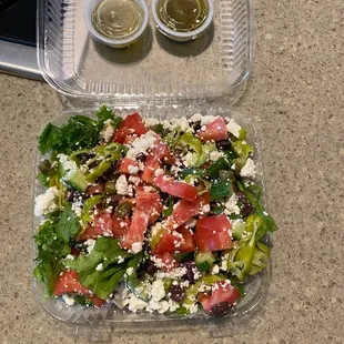 a salad in a plastic container