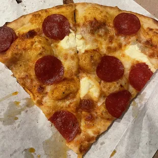 a slice of pepperoni pizza