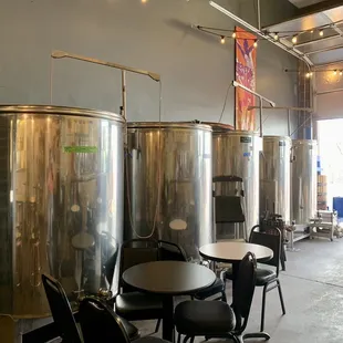 a row of stainless steel tanks