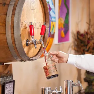 We feature wine on tap in 1 Liter refillable growlers.