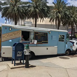 a food truck parked on the side of the road