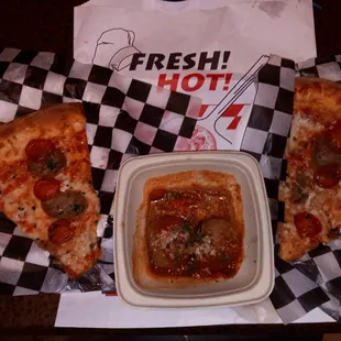 Two lunch special slices and a side of meatballs.