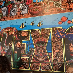 a mexican mural on the wall