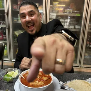 a man pointing at the camera