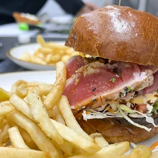 a sandwich and french fries on a plate