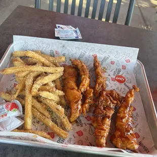 Chicken strips spicy and the fries.