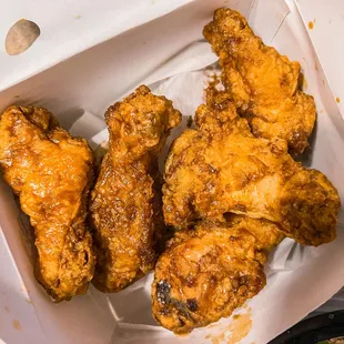 chicken wings in a box with dipping sauce