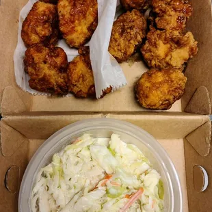 Boneless chicken with half-soy garlic and half-spicy sauce, and coleslaw