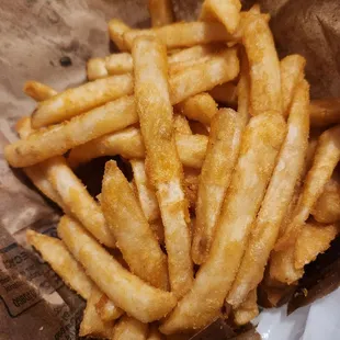 french fries in a brown paper bag