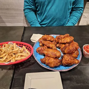 Seasoned fries, wing and drumstick combo, kimchi