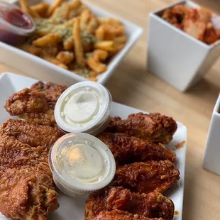 a plate of fried chicken and french fries