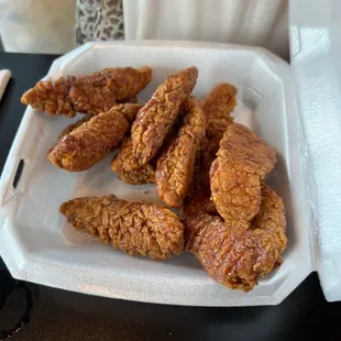 fried chicken wings in a styrofoam container