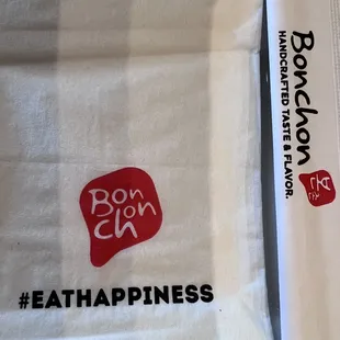 a white towel with a red logo on it