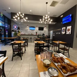 a view of a restaurant with tables and chairs